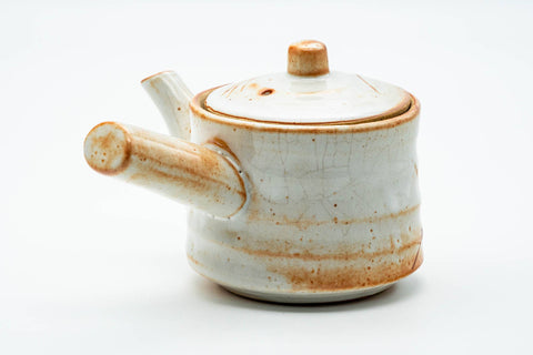Three-quarter rear view of the teapot with the side handle extended.