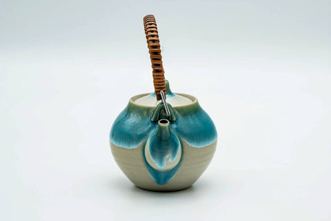 Turquoise Agano-yaki top-handled teapot, rear three-quarter view showing the handle mounts and turquoise drips