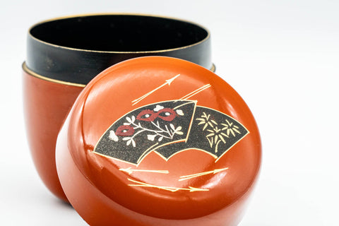Japanese Natsume - Orange Gold Floral Lacquered Matcha Tea Caddy - 100ml - top-down closeup of the lid showing the gold-trimmed floral fan motif