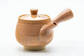 Japanese Kyusu - Pink Hagi-yaki Ceramic Filter Teapot - 300ml - three-quarter front view, lid on, spout to the left and side handle to the right, warm pink-tan clay