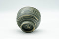 Japanese Teacup - Green, Yellow, and White Nerikomi Tokoname-yaki Yunomi - 100ml - tilted view showing the marbled pattern and base