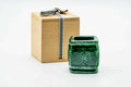 Green-glazed futaoki (lid rest) shown beside its wooden storage box.
