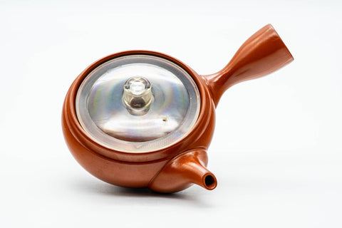Overhead view showing the clear plastic inner lid seated over the mouth of the pot.