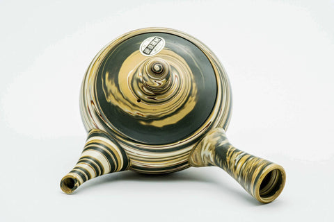 Overhead view of the teapot showing the lid, knob, handle and spout.