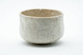 Front view of the chawan showing the pale grey-white textured surface.