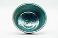 Overhead interior view showing the pooled turquoise glaze inside the bowl.