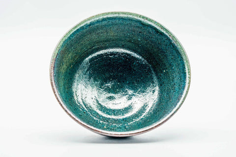 Overhead interior view showing the pooled turquoise glaze inside the bowl.