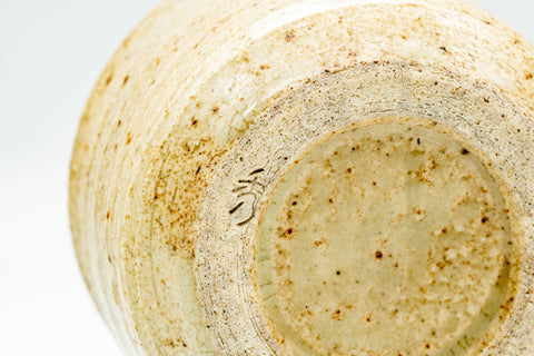 Underside of the teacup showing the unglazed stoneware foot ring.