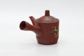 Side profile with the spout pointing.