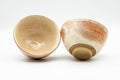 Japanese Teacups - Pair of Blush Orange and White Shino Glazed Yunomi - 120ml - the pair with one teacup tilted to show the base
