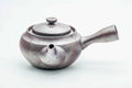 Three-quarter view of the large banko kyusu with the collared lid on.