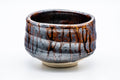Opposite side showing the streaked metallic brown drip glaze