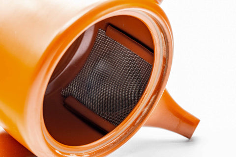 Interior view of the red shudei Tokoname kyusu showing the integrated clay mesh strainer wall