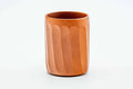 Side view of the carved red-clay teacup.