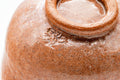 Close-up of the body and foot showing glaze texture and the carved foot ring.