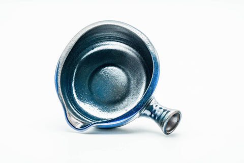 Top-down view of the water cooler showing the open mouth, interior, and side handle.