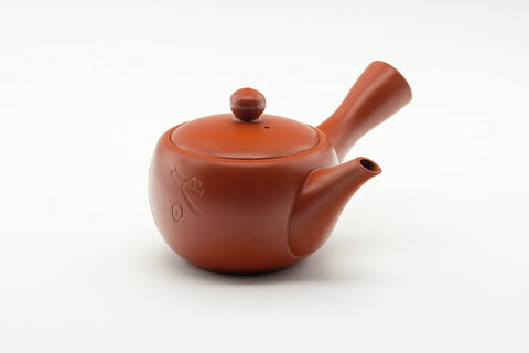 Tezumi — Japanese Tea Set - Kanji Engraved Tokoname-yaki Kyusu Teapot with 5 Yunomi Teacups — the teapot in three-quarter view