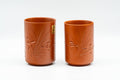 Japanese Teacups - Pair of Bamboo Engraved Tokoname-yaki Meoto Yunomi - front view of the pair of tall cylindrical red shudei teacups side by side