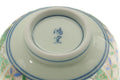 Underside of the Arita yunomi showing the blue maker's mark stamped on the white porcelain foot