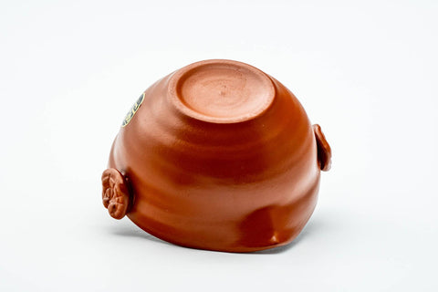 Three-quarter view of the underside, showing the rounded base and foot.