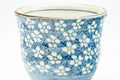 Tezumi — Japanese Teacup - Blue and White Floral Patterned Yunomi - 175ml — tipped to show the interior