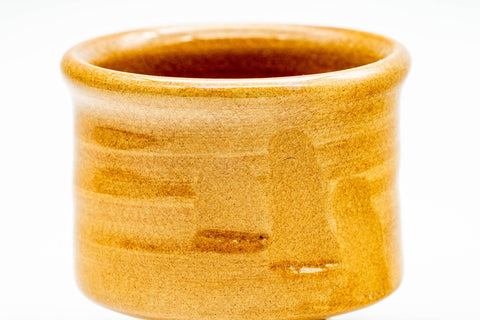 Top-down view into the guinomi showing the glazed interior and rim.