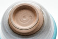 Underside view of the Agano-yaki teacups showing the unglazed clay foot