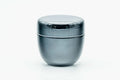 The small black lacquer natsume with lid on, front view showing its rounded shoulder.