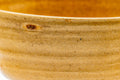 Close-up of the bowl's rim and wall, showing the fine crackle in the yellow Ki-Seto glaze.