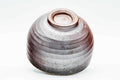 Inverted view of the Bizen chawan showing the carved foot and spiral underside