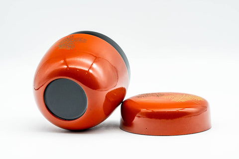 Japanese Natsume - Orange Lacquer Gold Geometric Matcha Tea Caddy - 100ml - tilted view showing the base and the lid beside it