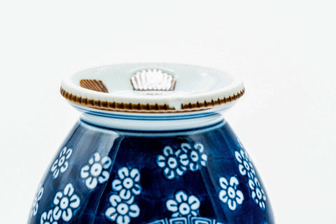 View of the lower body and foot, showing a blue maker's mark.