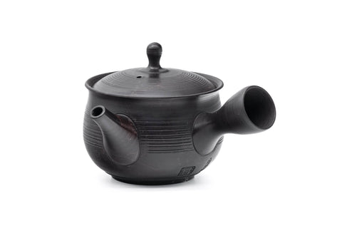 Spiraling benishibori Tokoname teapot, side view showing the handle