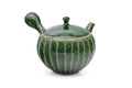 Green faceted Oribe Tokoname teapot, three-quarter front view