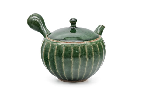 Green faceted Oribe Tokoname teapot, three-quarter front view