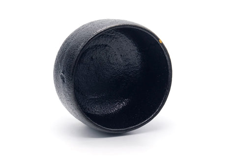 Overhead view into the black glazed interior.