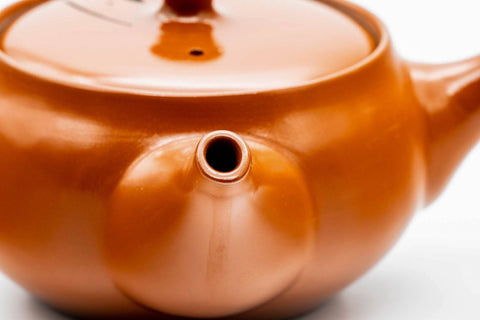 Close-up of the spout and engraved body.