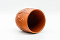 Tezumi — Japanese Teacup - Floral Sculpted Red Shudei Tokoname-yaki Yunomi - 125ml — three-quarter view