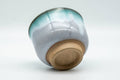 Tezumi — Japanese Teacup - Turquoise Drip-Glazed Agano-yaki Yunomi - 100ml — top-down view of the interior