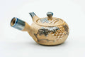 Side view of the kyusu with the handle to the left, lid on.