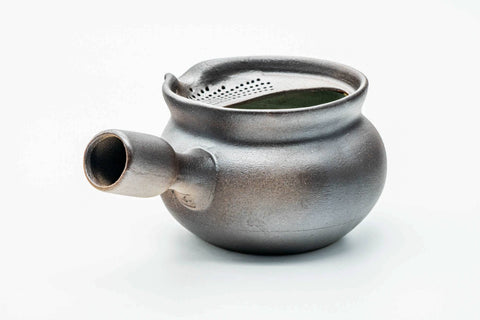 Dark yohen lidless kyusu, side profile with the spout to the left and handle to the right