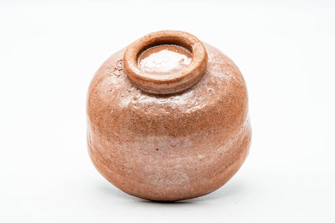 Bowl tilted to show the unglazed foot and base.
