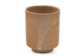 Tezumi — Japanese Teacup - Beige Cream Glazed Hagi Yunomi - 210ml — tipped to show the interior