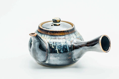 Rear three-quarter view of the drip-glazed kyusu showing the side handle.