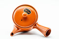 Overhead view of the lid and knob, with the engraved decoration visible on the body.