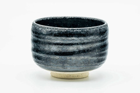 Black metallic chawan, front view showing the dark banded glaze