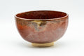 Japanese Matcha Bowl - Shiny Red and Yellow Drip-Glazed Wan-nari Chawan - 250ml - side view of the drip-glazed bowl