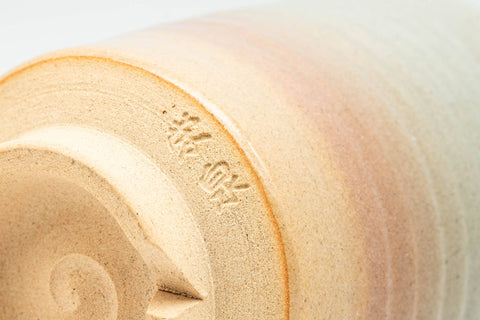 Tezumi — Japanese Teacup - Beige Pink Spiraling Hagi-yaki Yunomi - 160ml — tipped to show the interior