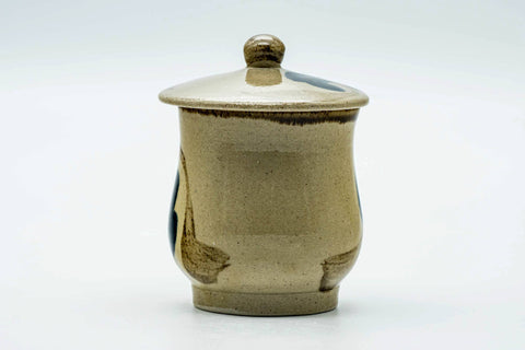 The faceted lidded cup viewed from another angle.