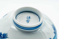 Underside of the cup showing the foot and a blue maker's mark.